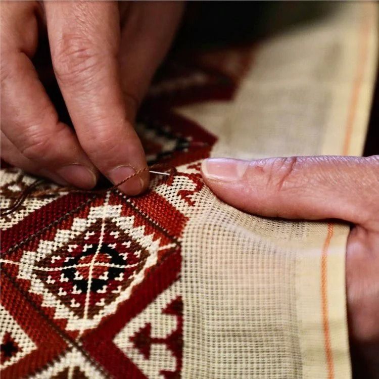 Palestinian tatreez embroidery being stitched by hand