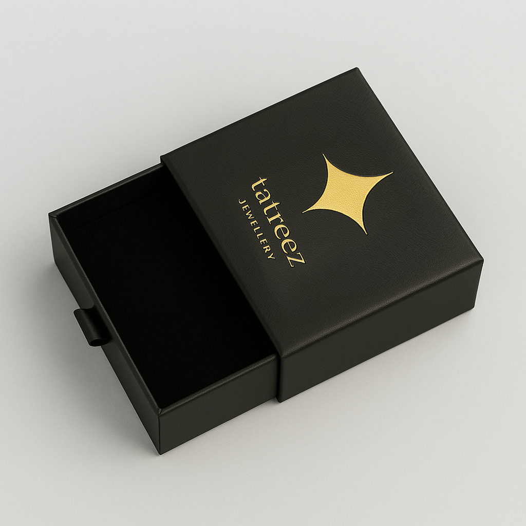 Black jewelry box with 'tatreez jewelry' logo on a black background